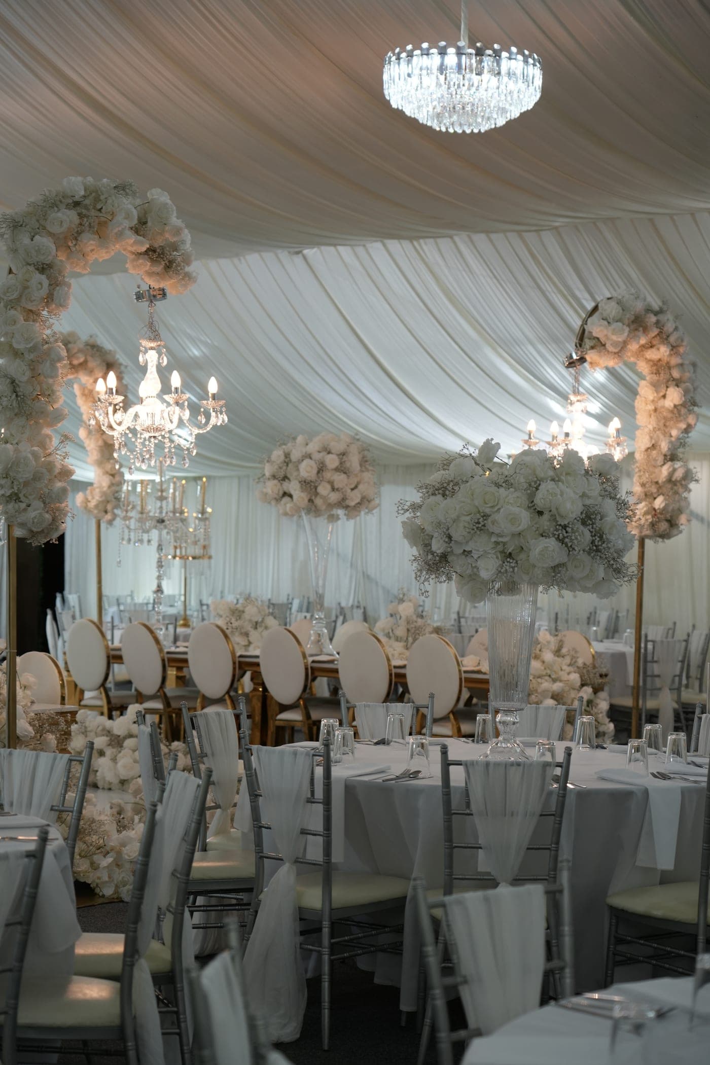 Chandeliers and staging inside the Lost Garden Marquee