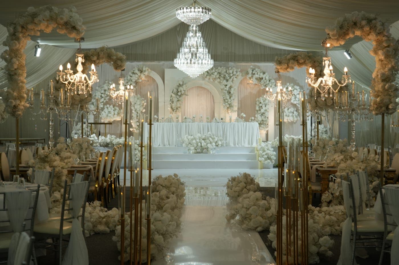 Banquet seating beneath the marquee's chandeliers